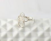 many circles ring on geometric vase