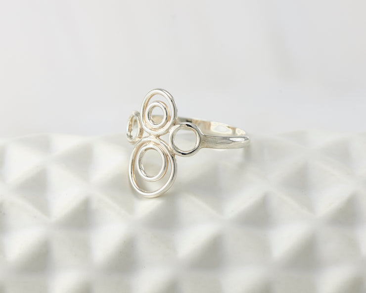 many circles ring on geometric vase