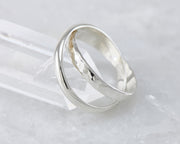 interlocking russian wedding rings on crystal rock