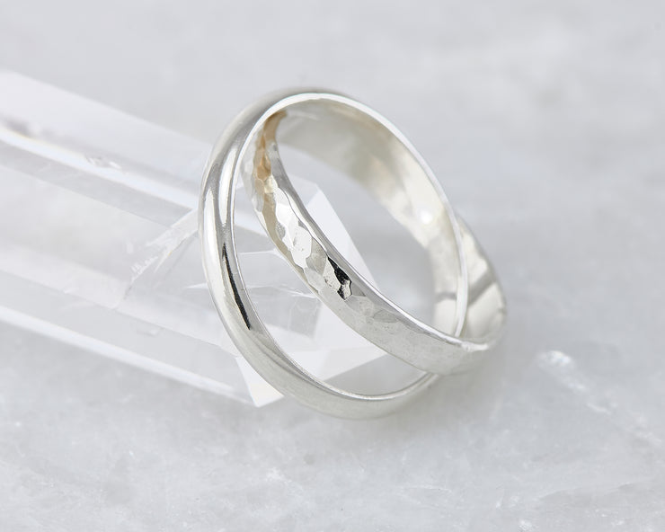 interlocking russian wedding rings on crystal rock
