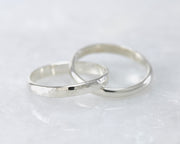 interlocking russian wedding rings on white marble