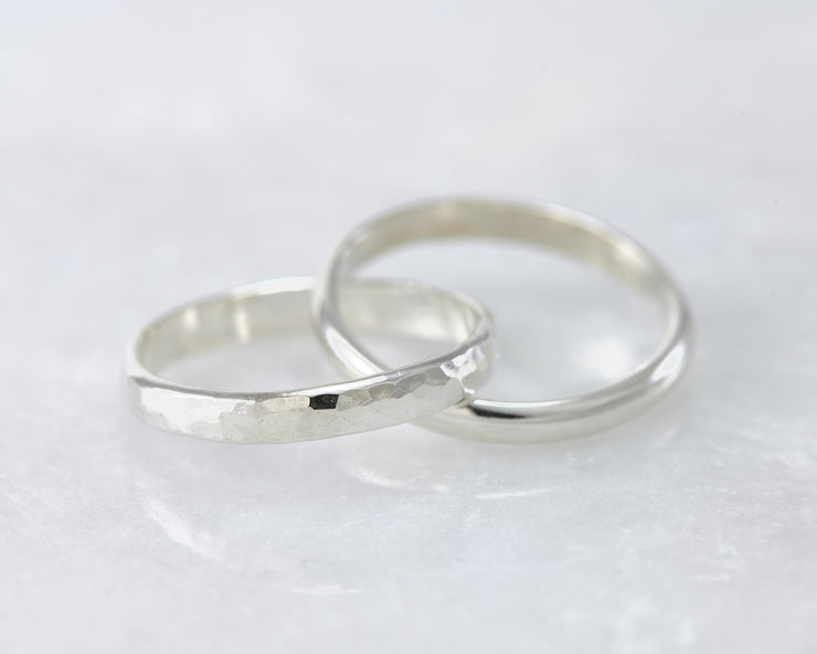 interlocking russian wedding rings on white marble