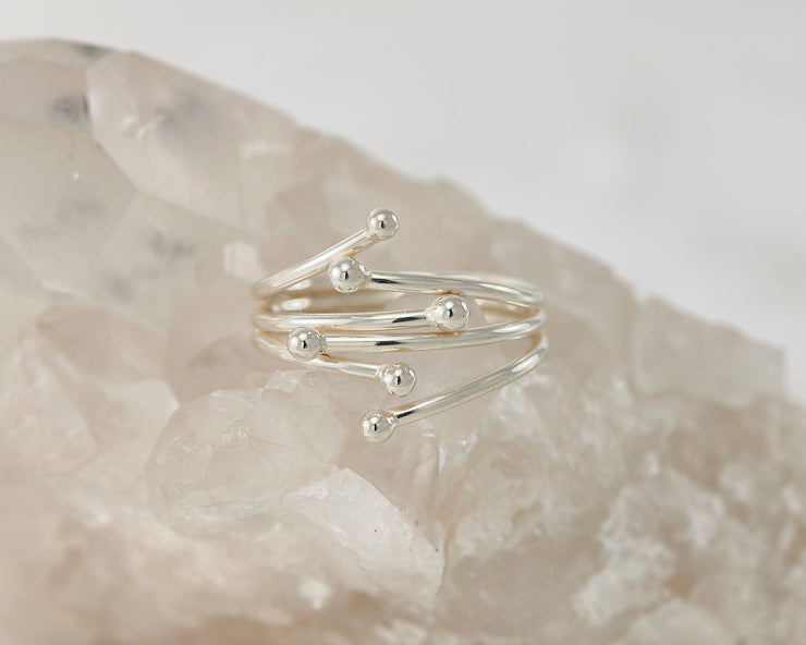 Silver wrap ring on crystal rock