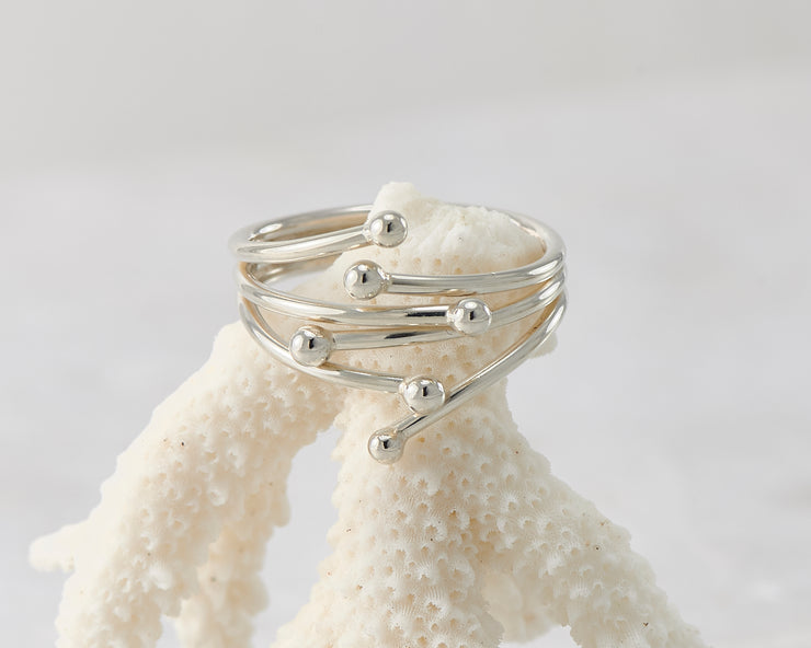 Silver statement ring on coral