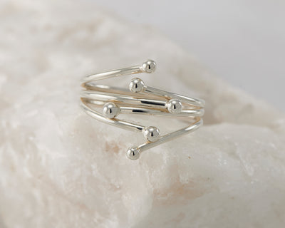 Silver statement wrap ring on white rock