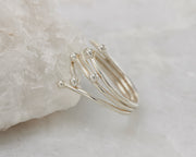 Silver statement wrap ring on white rock