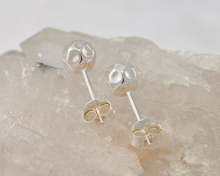 silver hammered stud earring on crystal rock