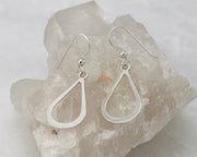 Silver teardrops earrings on crystal rock