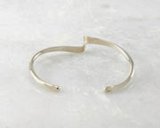 bracelet silver cuff open on marble