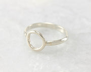 simple circle silver ring on white marble