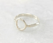 simple circle silver ring on white marble