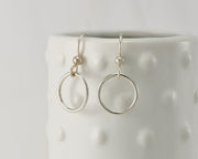 silver small hoop earrings on dotted vase