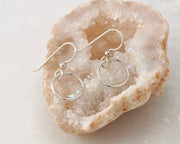 silver small hoop earrings on quartz