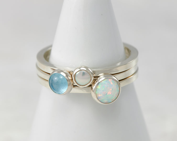 ring holder with silver stacking rings opal, pearl, blue topaz
