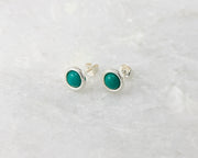 silver turquoise stud earrings on white marble