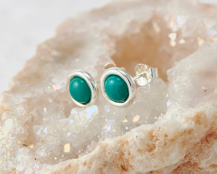 silver turquoise stud earrings on quartz