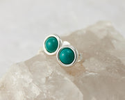 silver turquoise stud earrings on crystal
