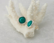 silver turquoise stud earrings on coral