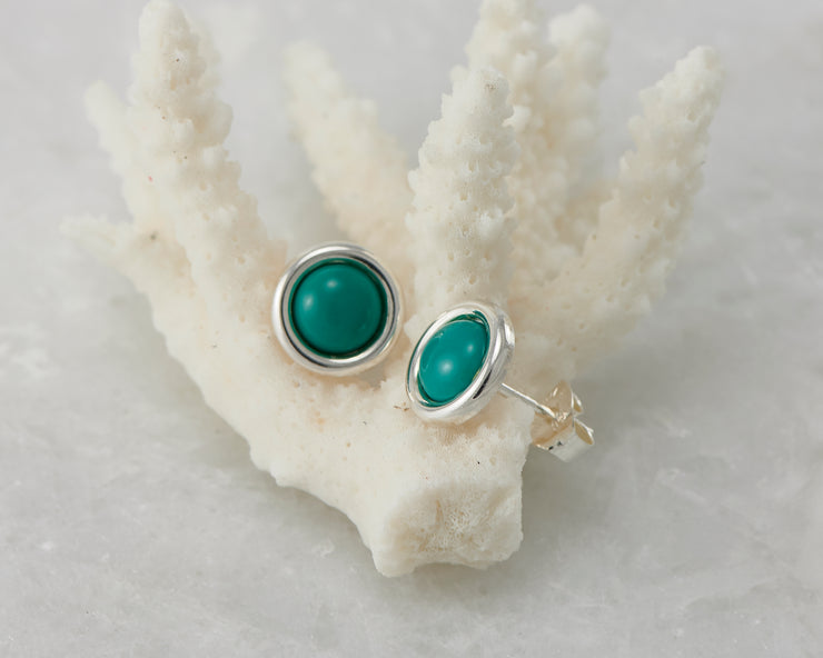 silver turquoise stud earrings on coral