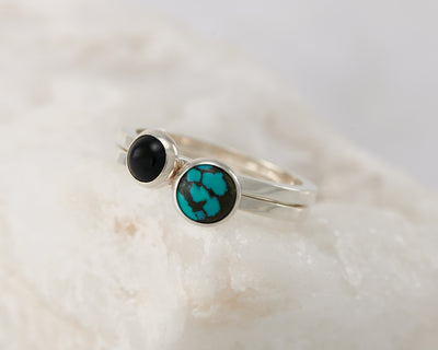 silver stacking rings turquoise and black onyx on white rock