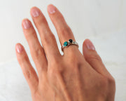 woman wearing turquoise & black onyx stacking rings