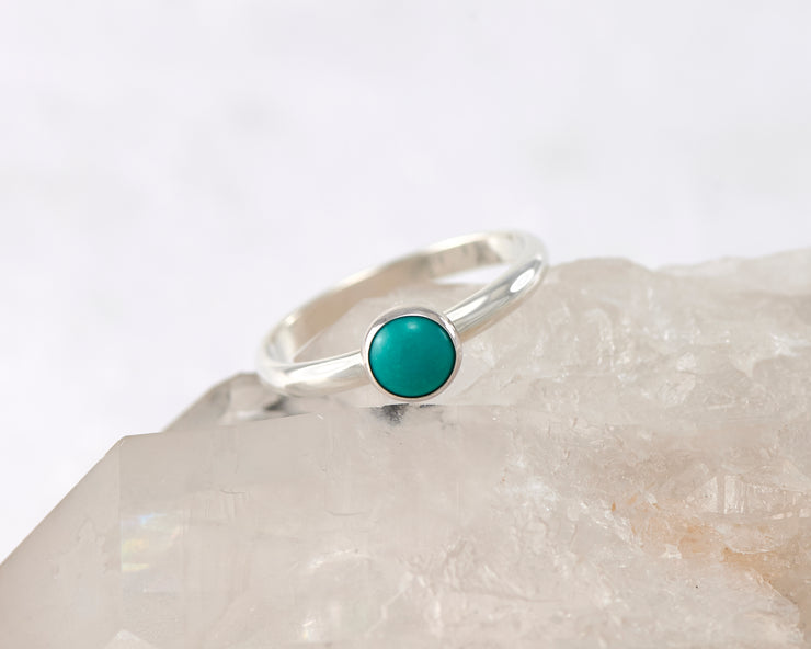 silver turquoise ring on crystal rock