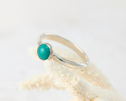 turquoise ring on coral