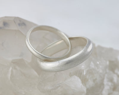 brushed Wedding bands set on crystal rock