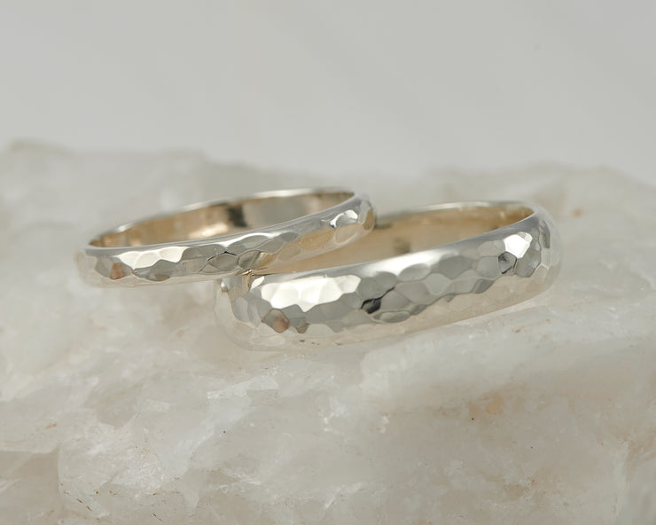 wedding ring set on white rock