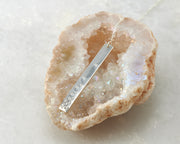 silver bar y-necklace on quartz